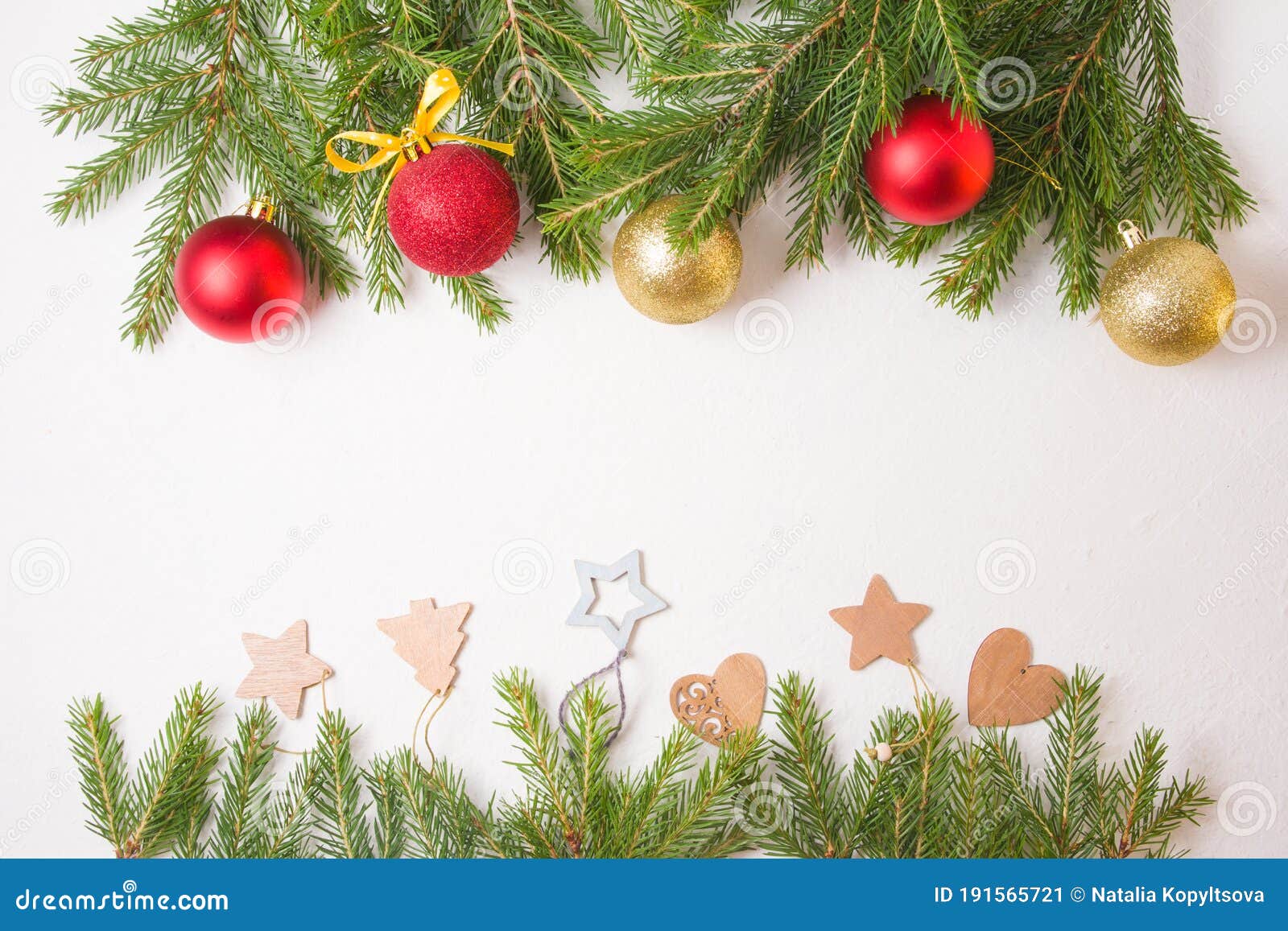 frame from christmas toys and natrual fir branches on a white background