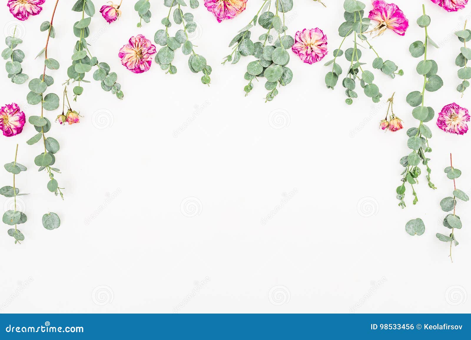 Frame of Pink Roses and Eucalyptus on White Background. Flat Lay, Top
