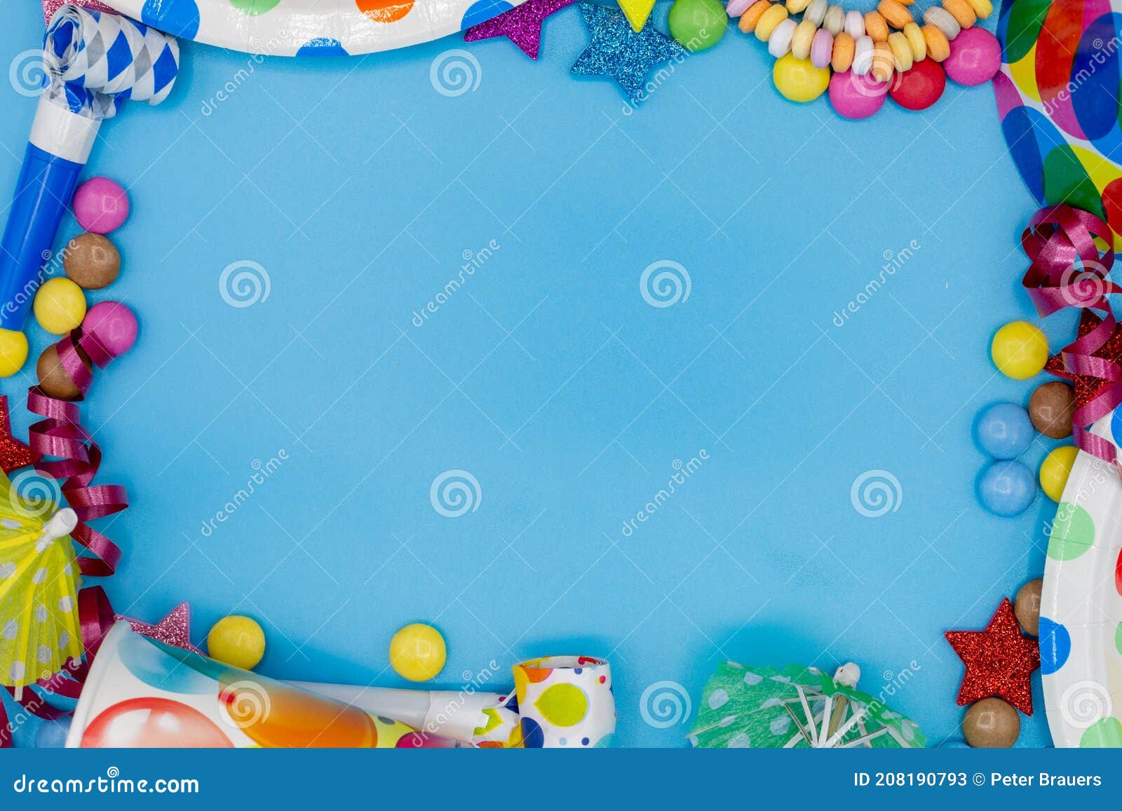 frame of various sweets and utensils for children's birthdays or parties with blue background and copy space