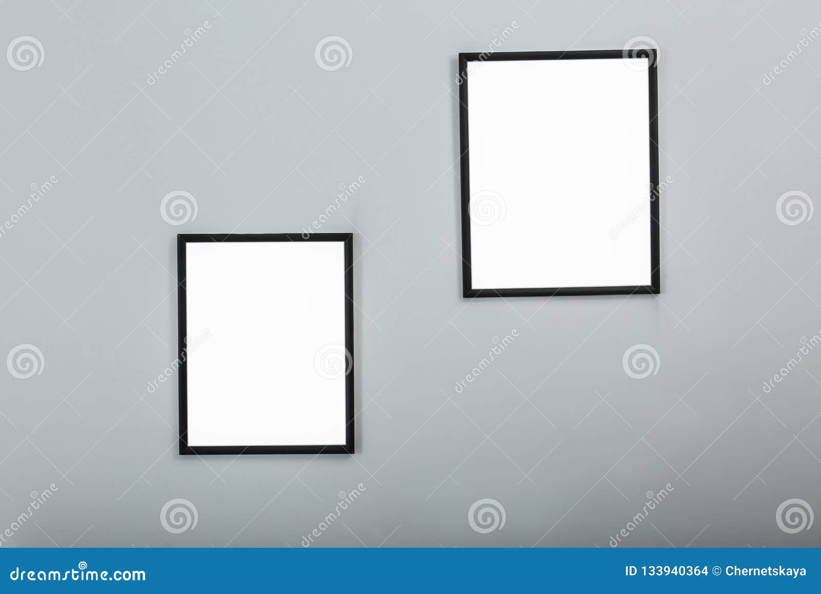Frames with Empty Canvases on Wall in Modern Art Gallery Stock Photo