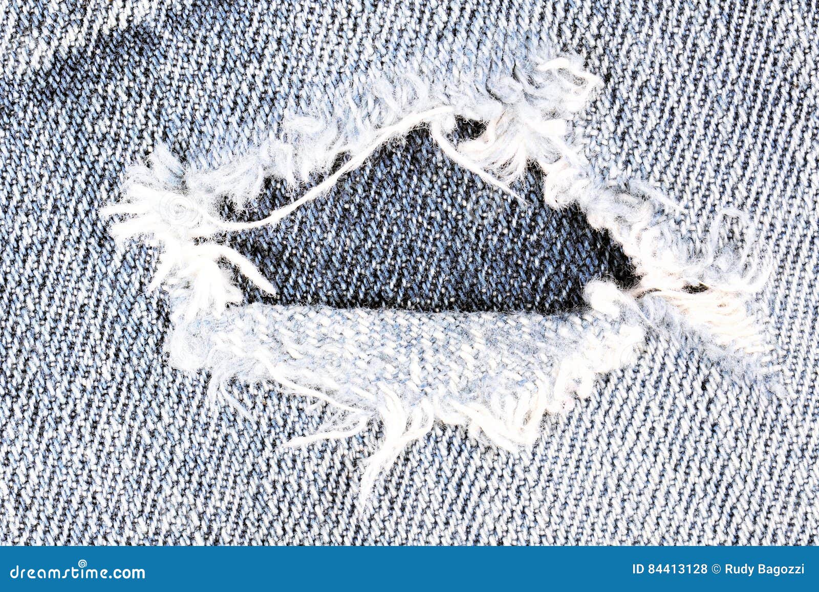 Frayed blue jeans closeup stock photo. Image of industries 84413128