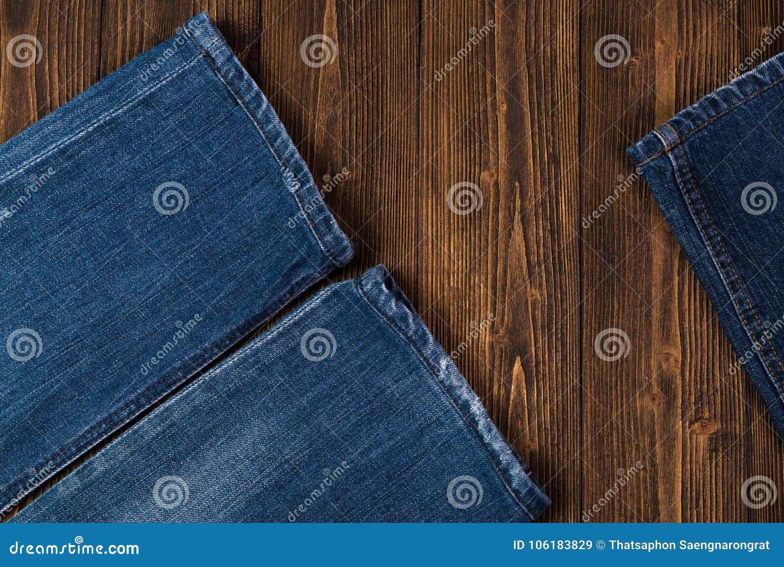 Frayed Jeans or Blue Jeans Denim Collection on Rough Dark Wooden Stock ...