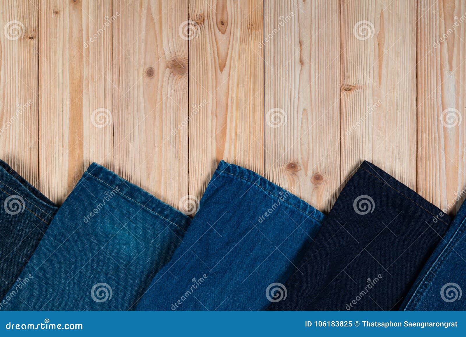 Frayed Jeans or Blue Jeans Denim Collection on Rough Wooden Table ...