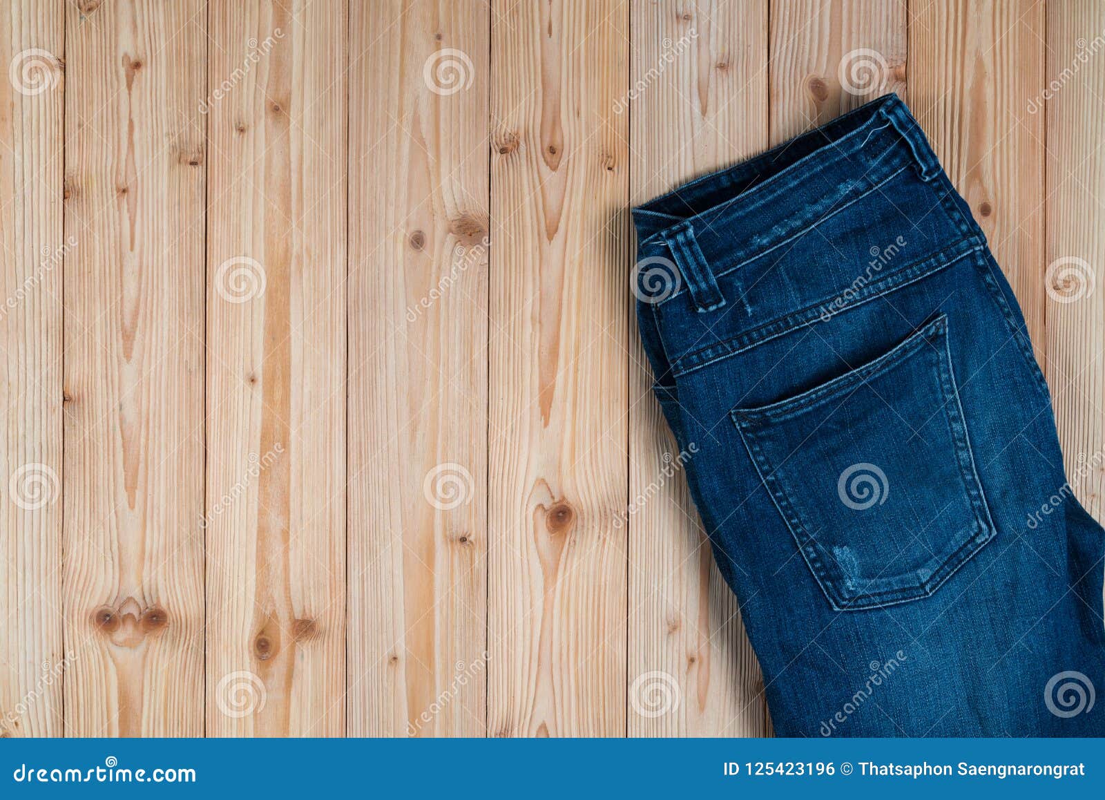 Frayed Jeans or Blue Jeans Denim Collection on Rough Wooden Table ...