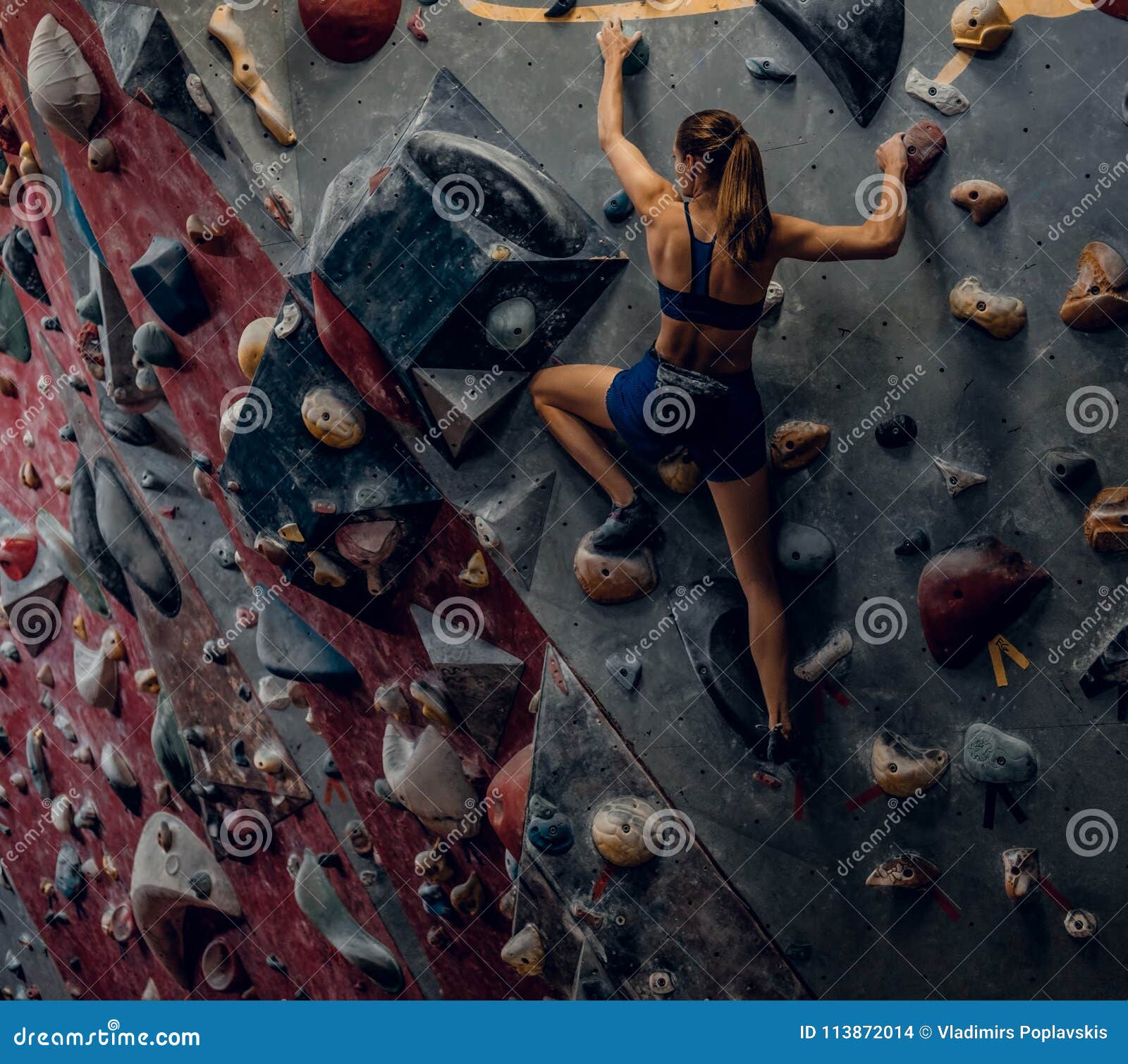 Free Climber Female Bouldering Indoors. Stock Photo Image of holds