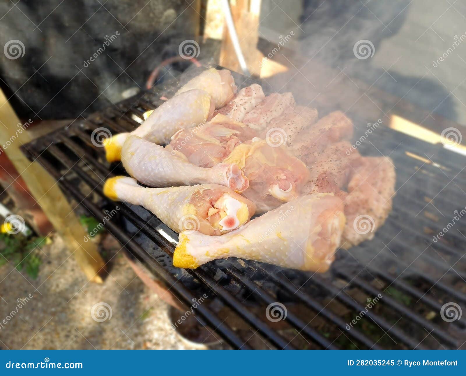 Free Range Chicken Thighs and Drumstick on the Charcoal Barbecue Stock
