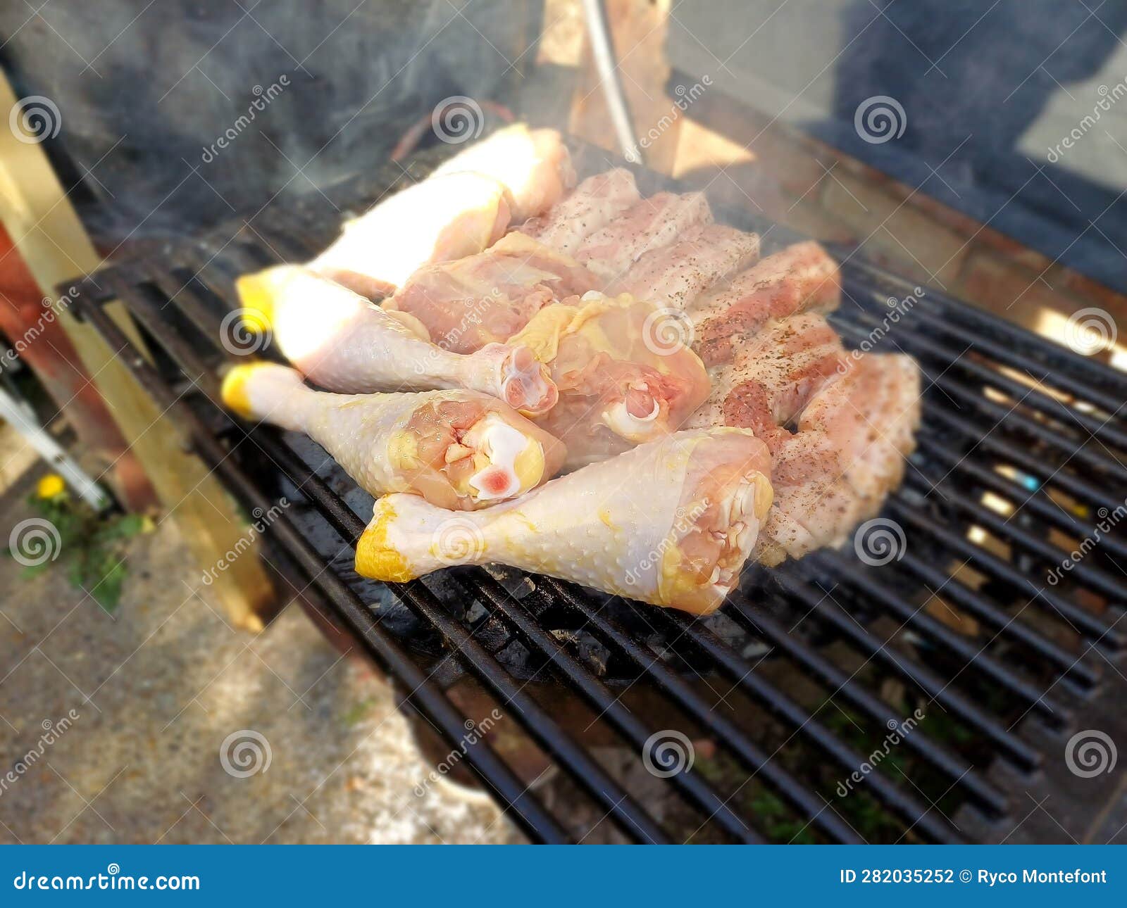 Free Range Chicken Thighs and Drumstick on the Charcoal Barbecue Stock