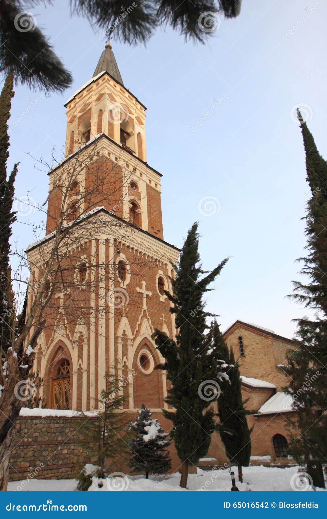 the free-standing three-storey bell-tower in monastery of st. nino at bodbe in winter