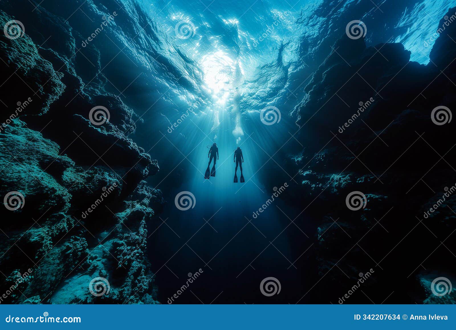 freedivers descending into ocean depths, exploring silent world beneath surface .two individuals are underwater diving in the