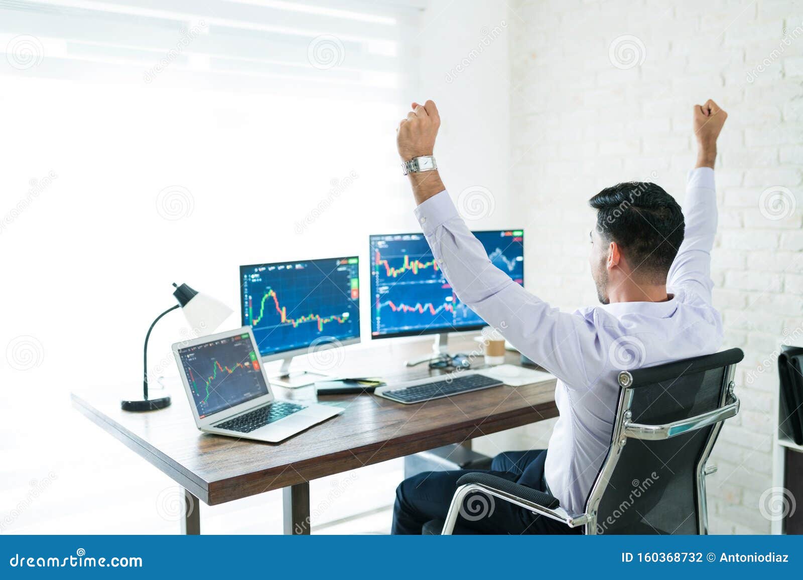 Excited Latin Finance Professional Sitting Computer Desk Stock