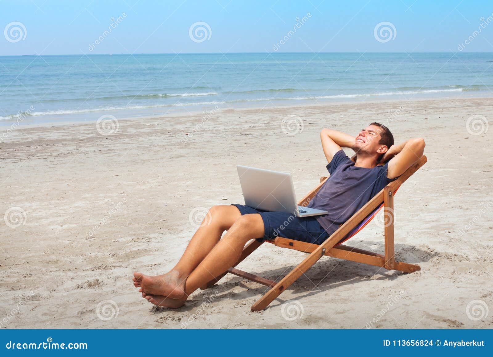 freelancer with laptop on the beach, successful happy business man relaxing