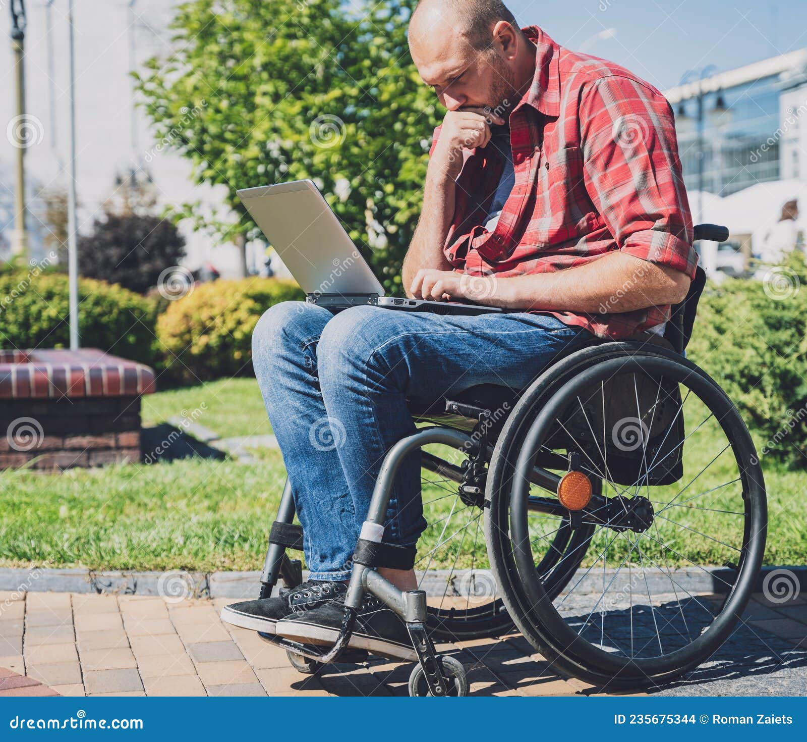 Freelancer with a Physical Disability in a Wheelchair Working at the