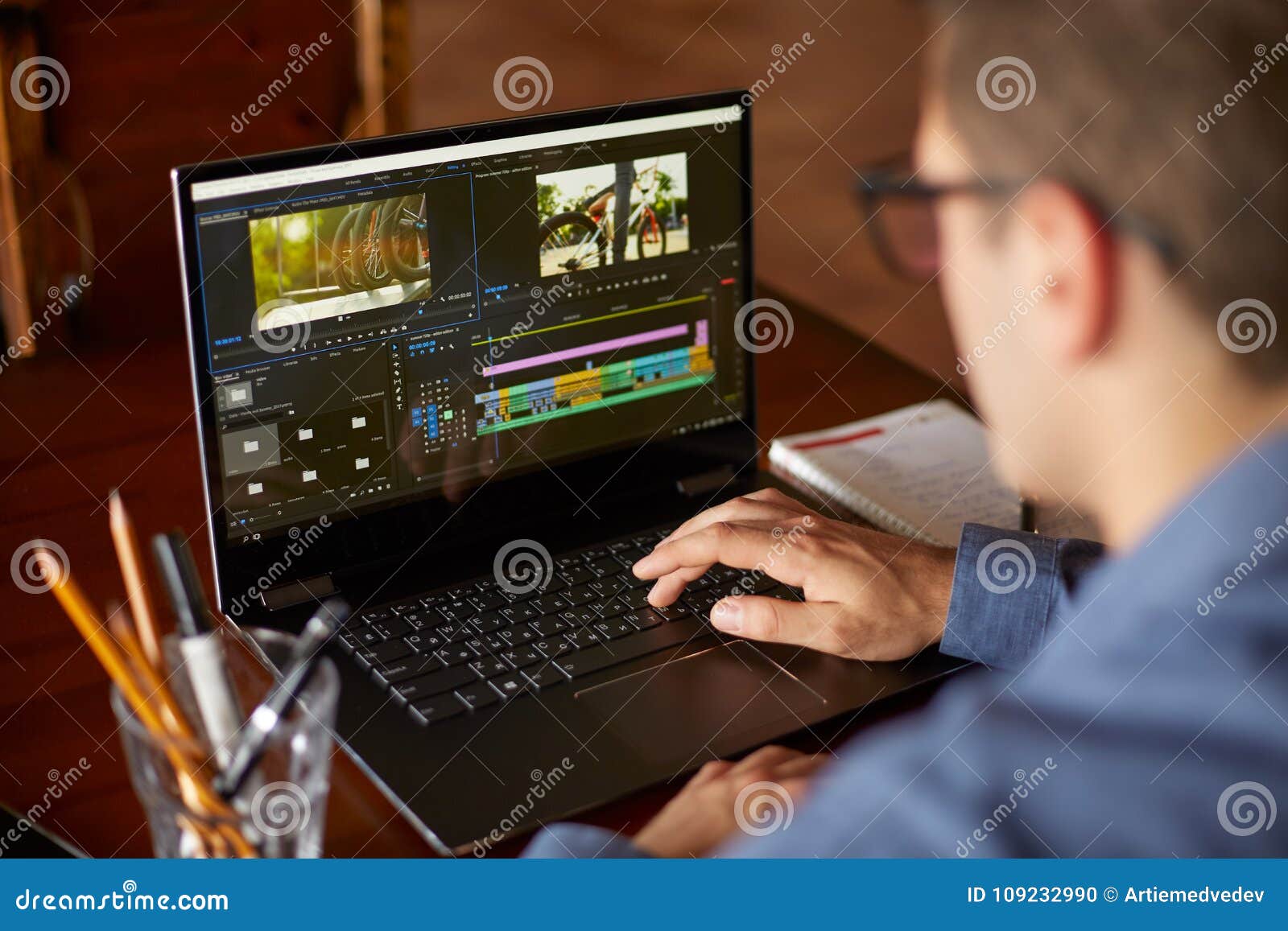 freelancer video editor works at the laptop computer with movie freelancer video