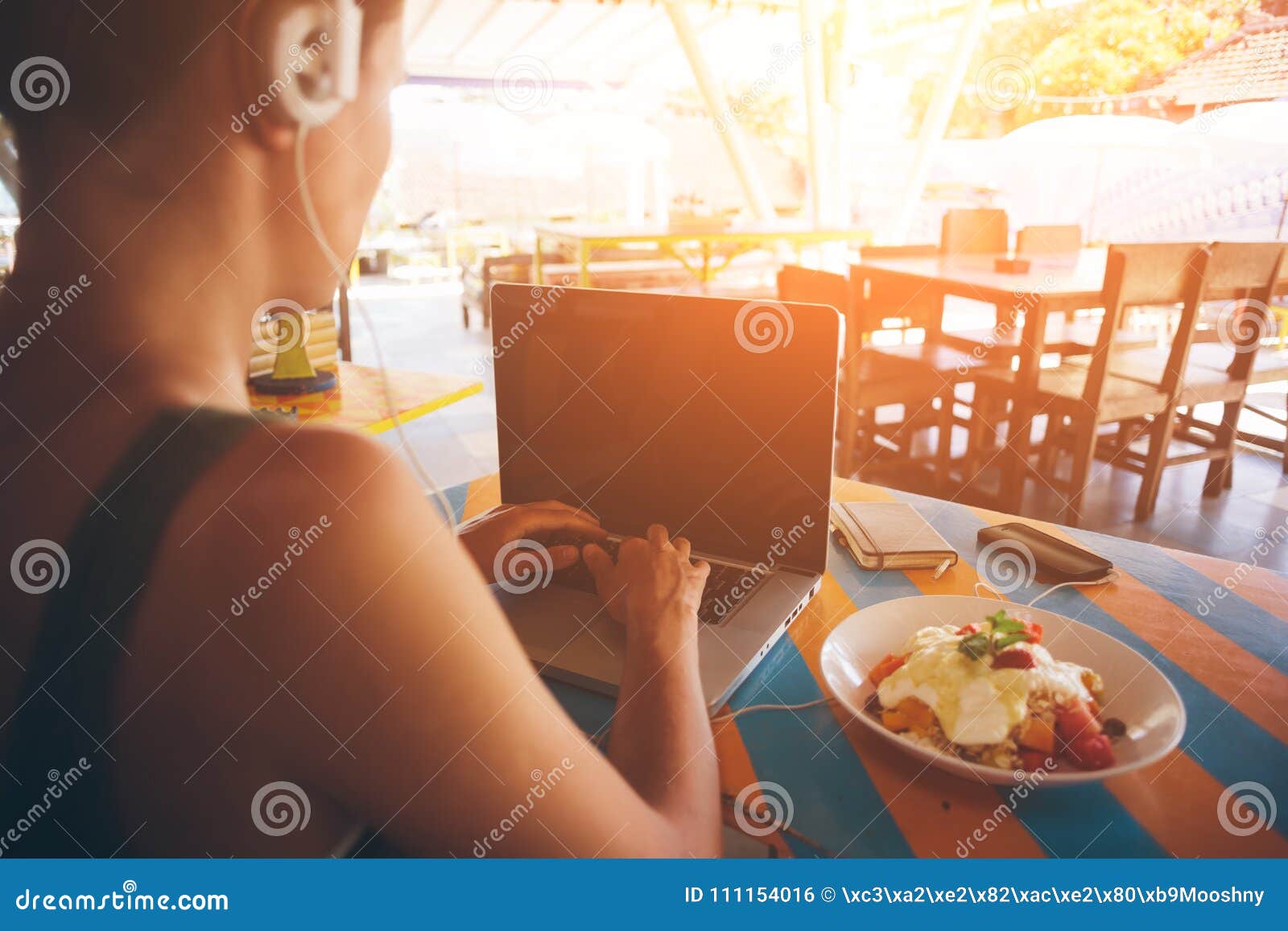 freelancer working at laptop in caffe