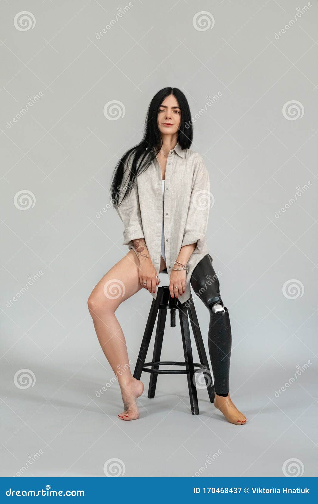 Studio Portrait Shot Of Body Positive Woman With Prosthetic Leg