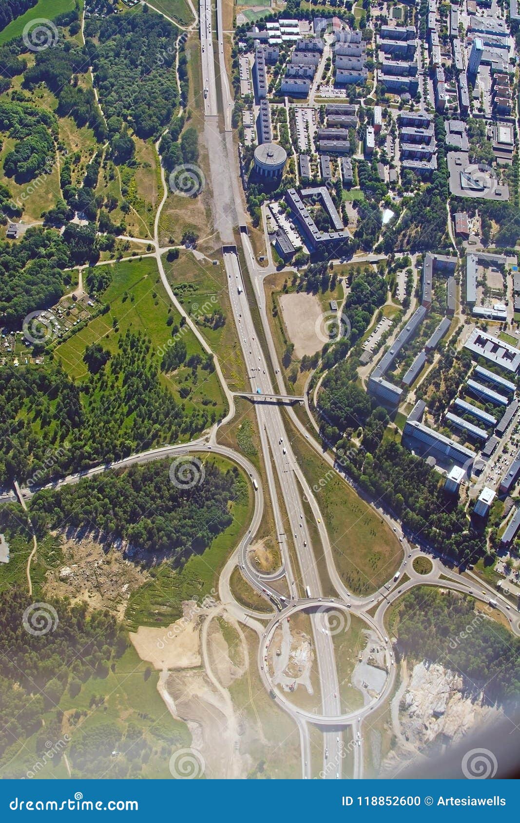 freeway and roundabout pattern with traffic aerial