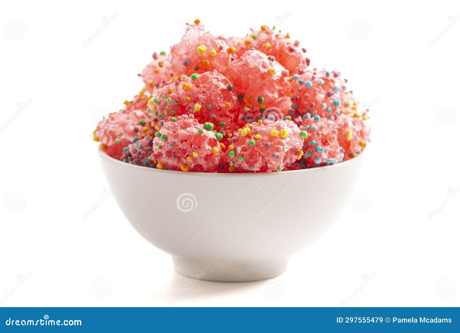 freeze dried sweet and tangy candy with small candies on the outside of a chewy center  on a white background