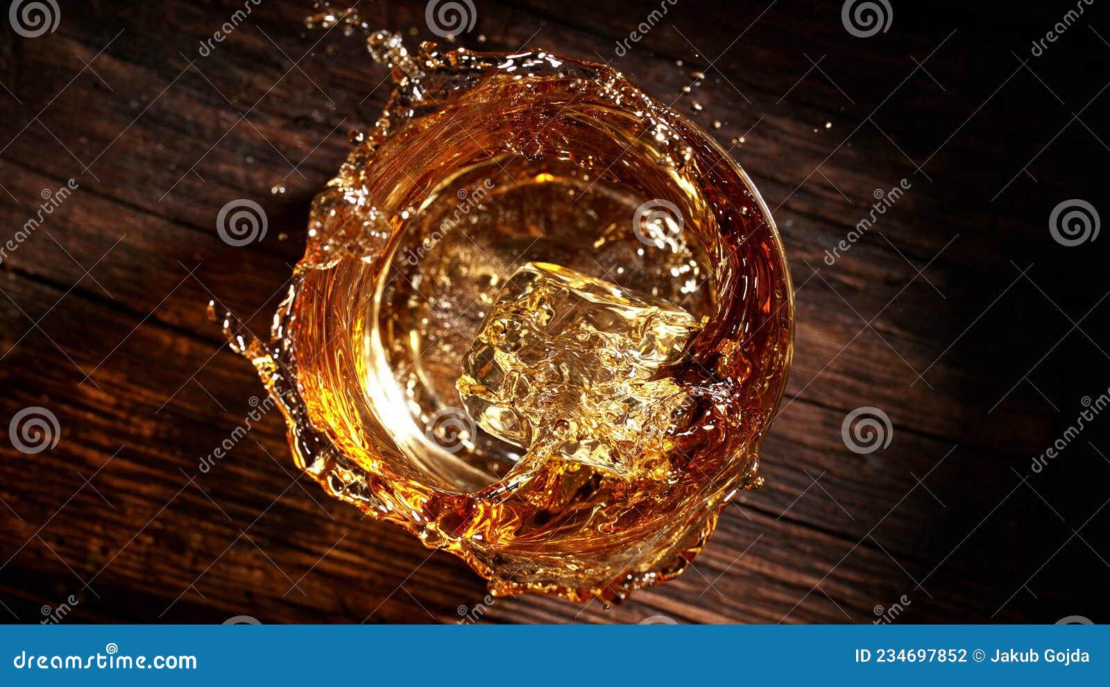 Freeze Motion of Falling Ice Cube into Glass Stock Photo Image of