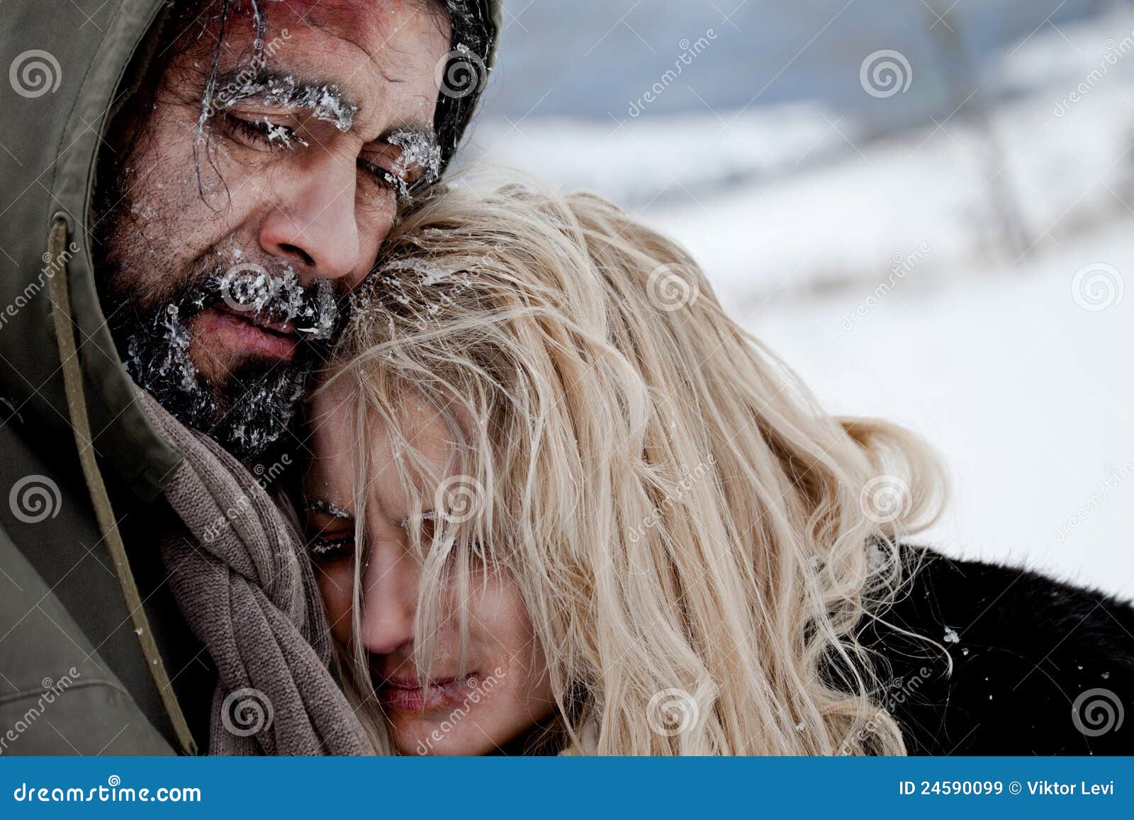 freezing homeless couple hugging