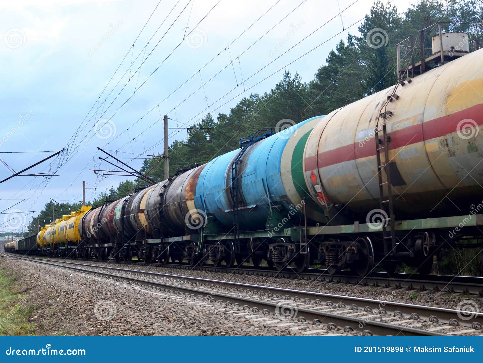 Freight Train with Petroleum Tank Cars on Railroad. Rail Cars Carry Oil