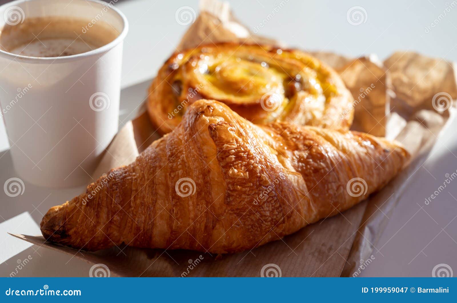 Croissant and a cup of tea French breakfast, Stock image