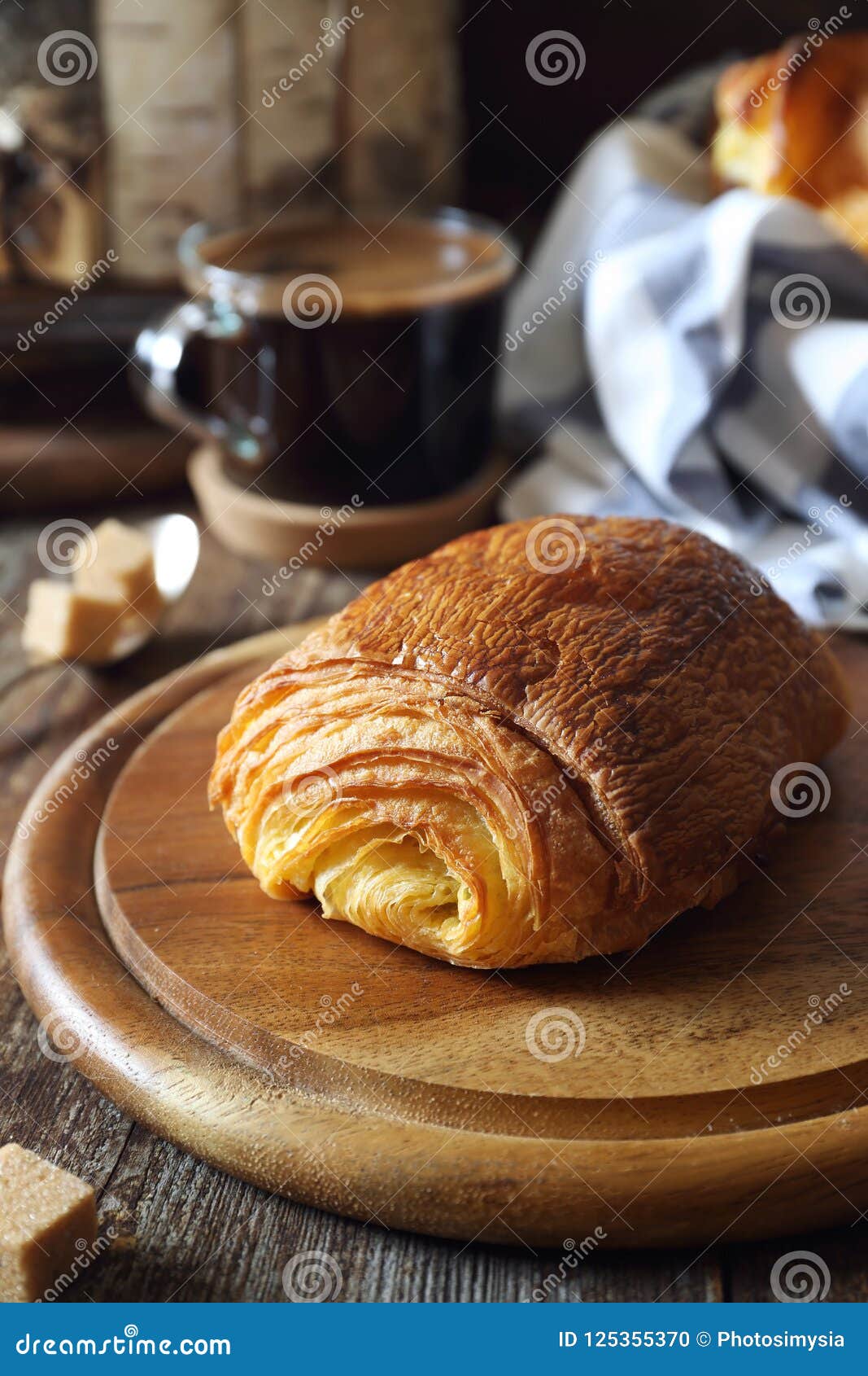 French Breakfast Sweet Puff Pastry Bun and Cup of Coffee Stock Photo