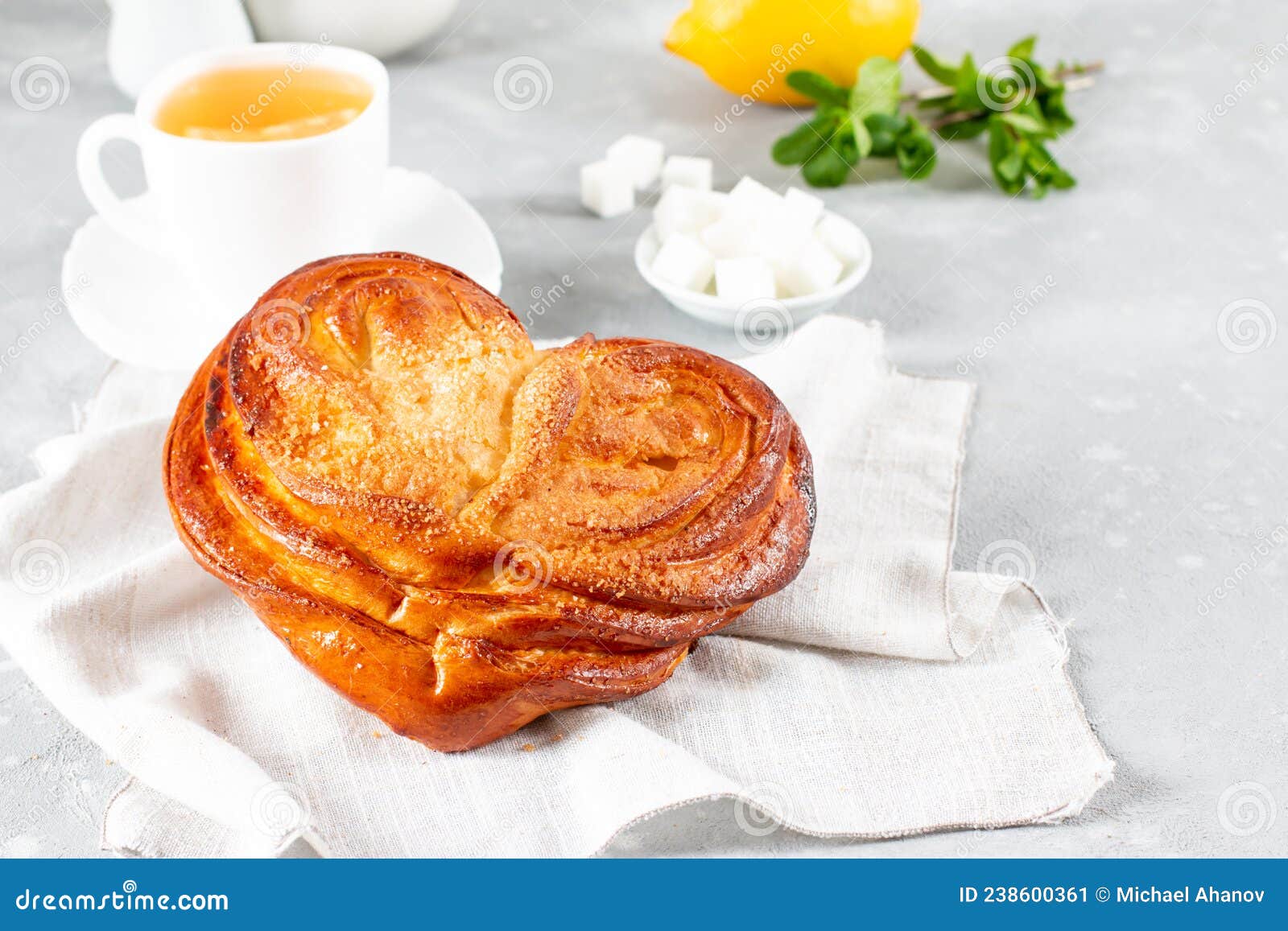 french buns with sugar. french pastry in palm leaf or butterfly . homemade buns, plushka