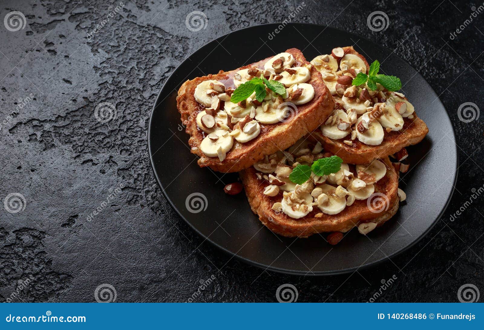 French Cinnamon Toast with Banana, Nuts and Hazelnut, Honey. Stock