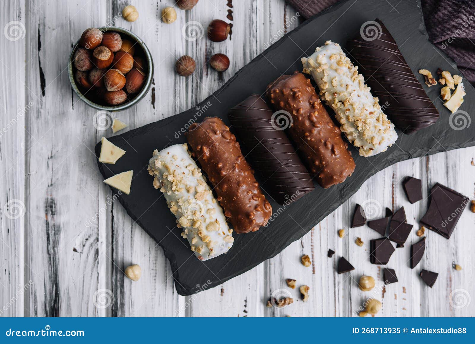 French Dessert Eclairs or Profiteroles with Different Chocolate Icing