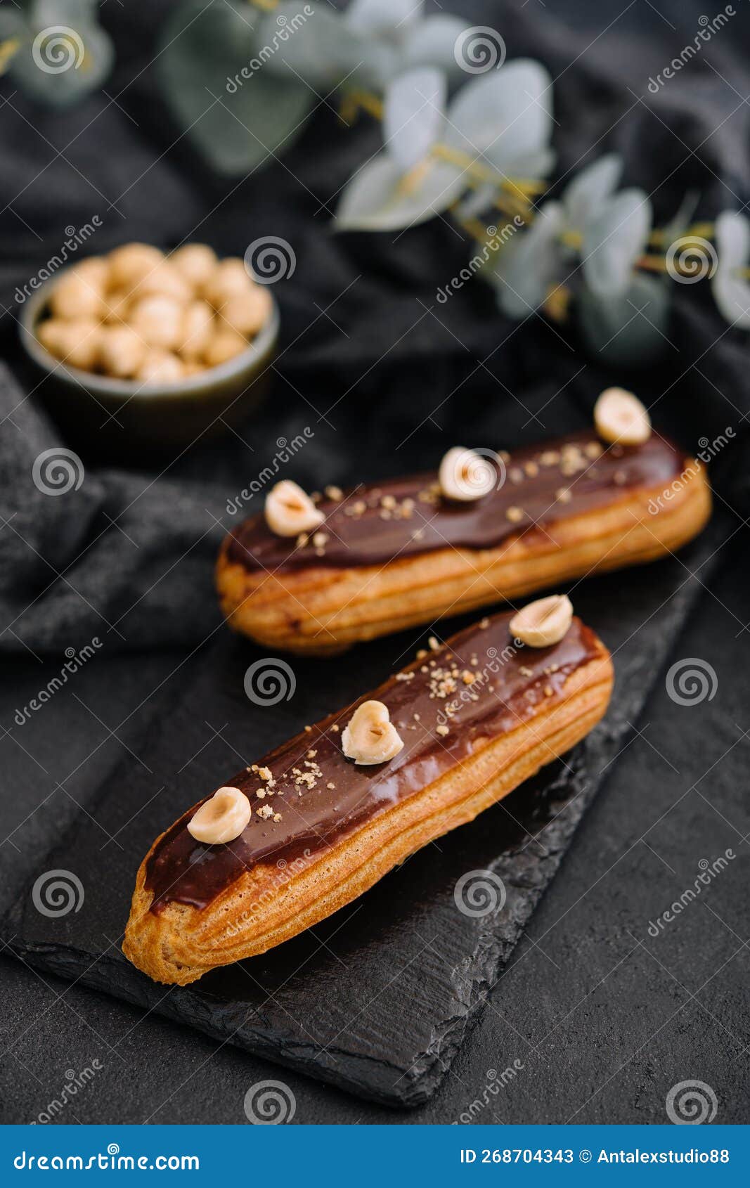French Eclairs with Chocolate and Hazelnuts Stock Image Image of