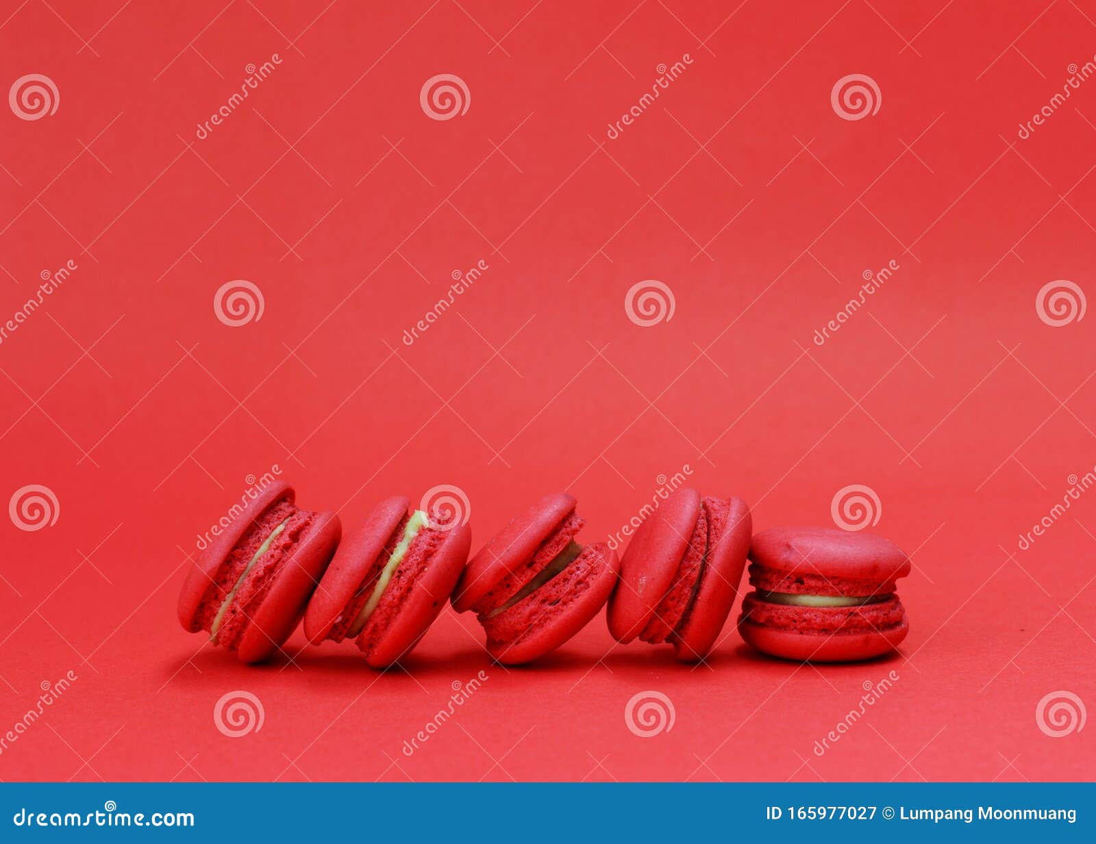 french macaroons stack on red backgrouds