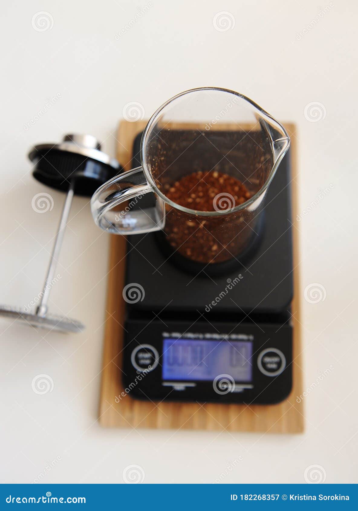 French Press with Ground Coffee. on Electronic Timer Scales. Top View