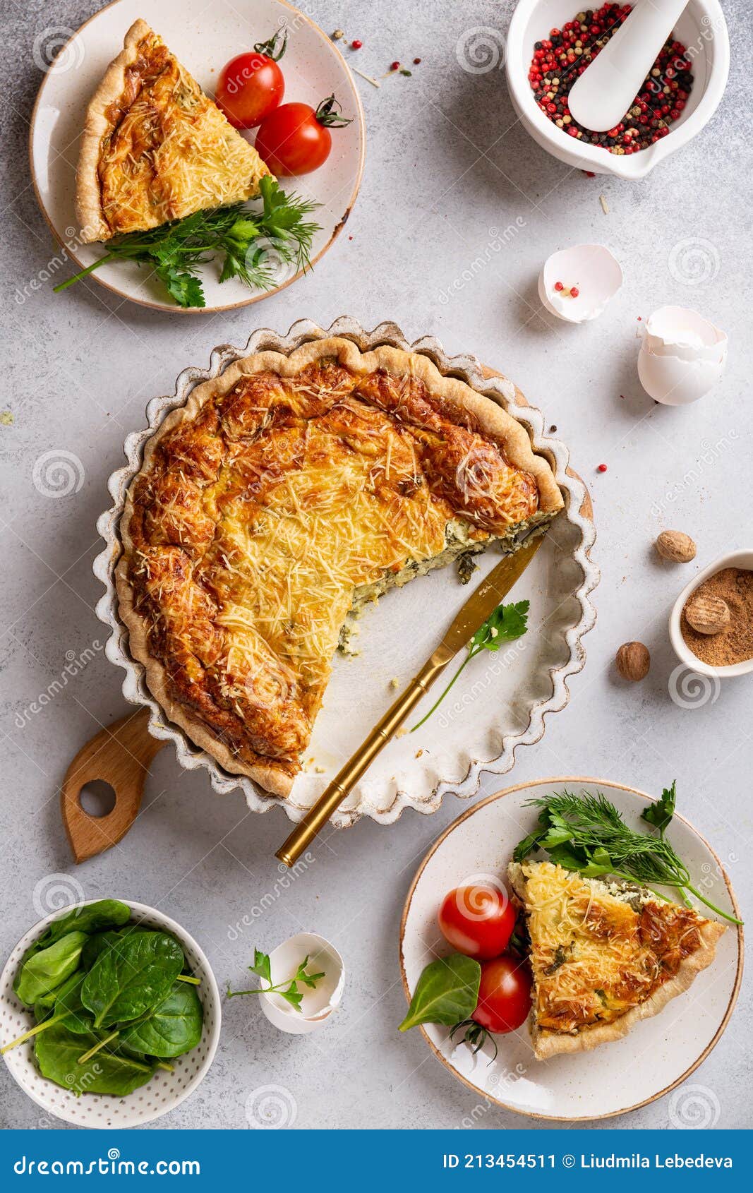 French Quiche Lorraine Cut into Slices and Served on Plates with ...