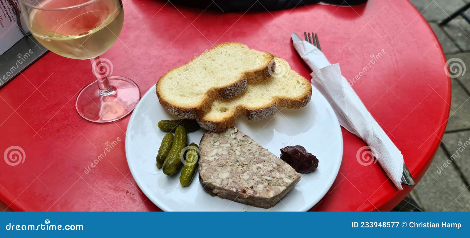 French Starter Consisiting of a Piece of Terrine and Pickles Stock