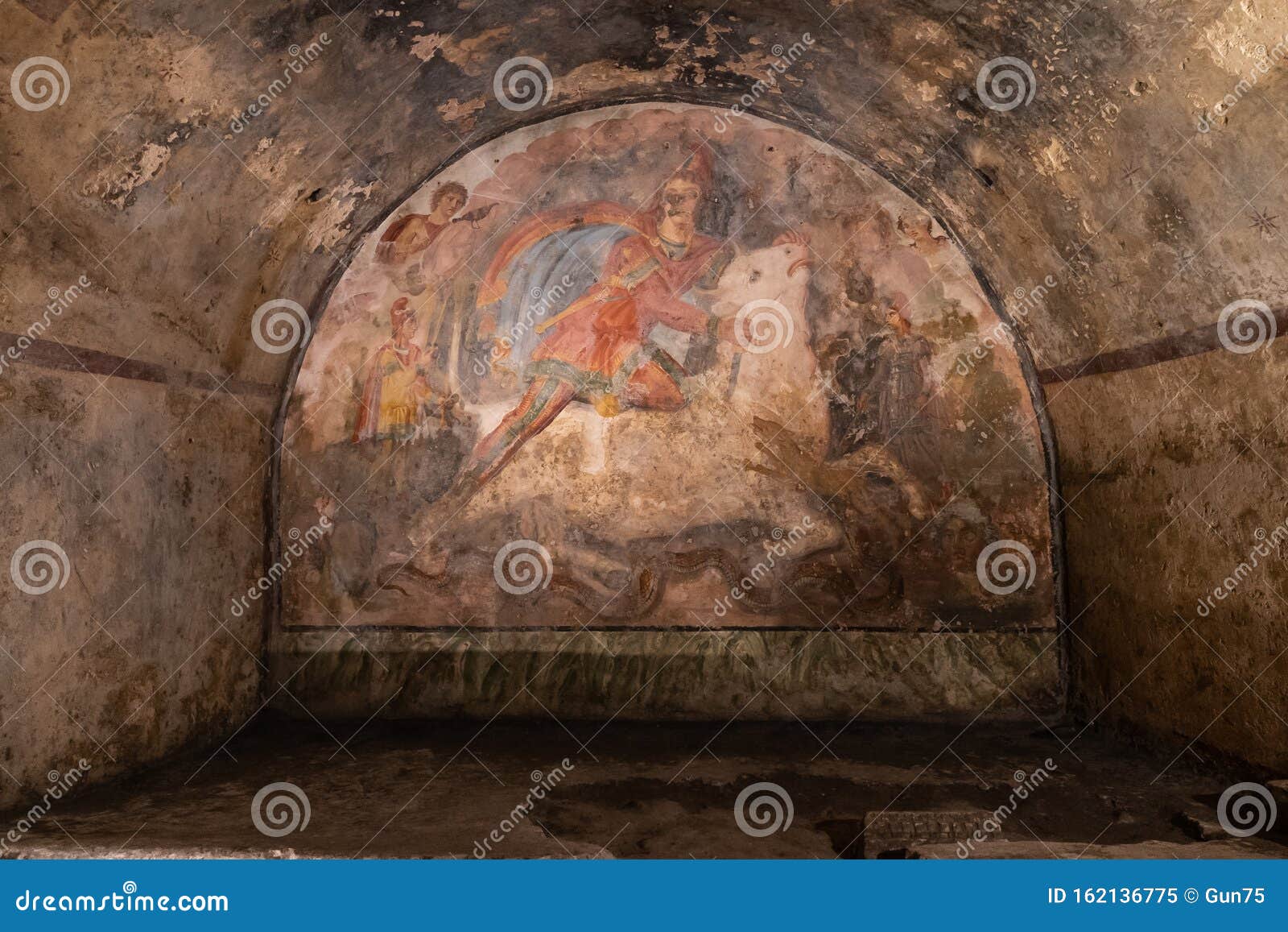fresco representing the mithras divinity was killing a white bull, inside of the mithraeum of ancient capua.