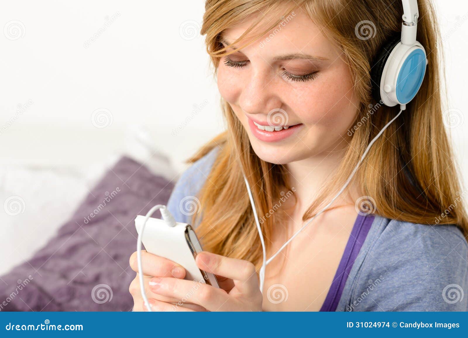 fresh adolescent girl listening to music