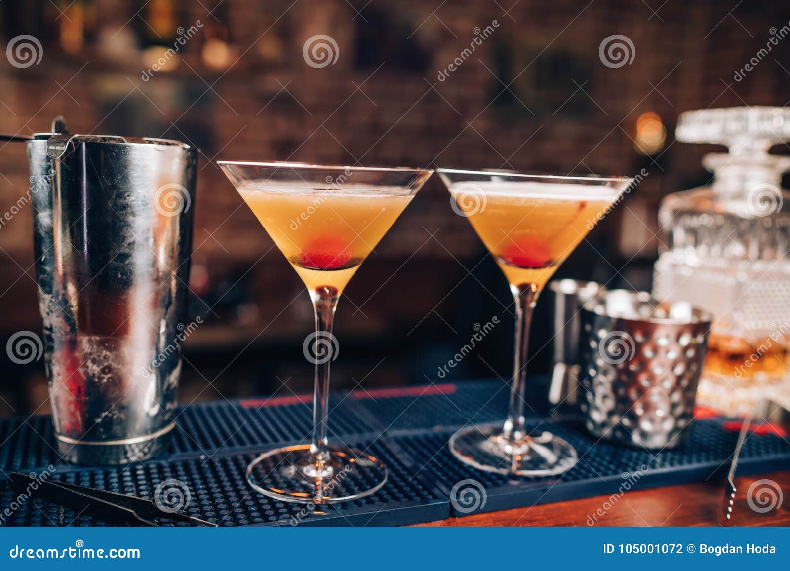 fresh alcoholic cocktails on bar counter. close up of bar details with beverages and drinks