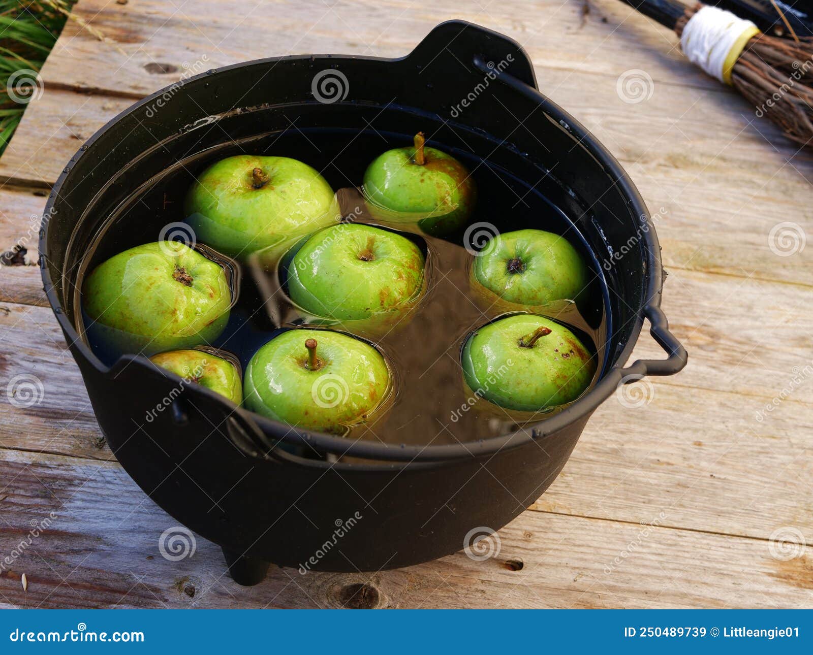fresh apples in a cauldron for bobbing at halloween
