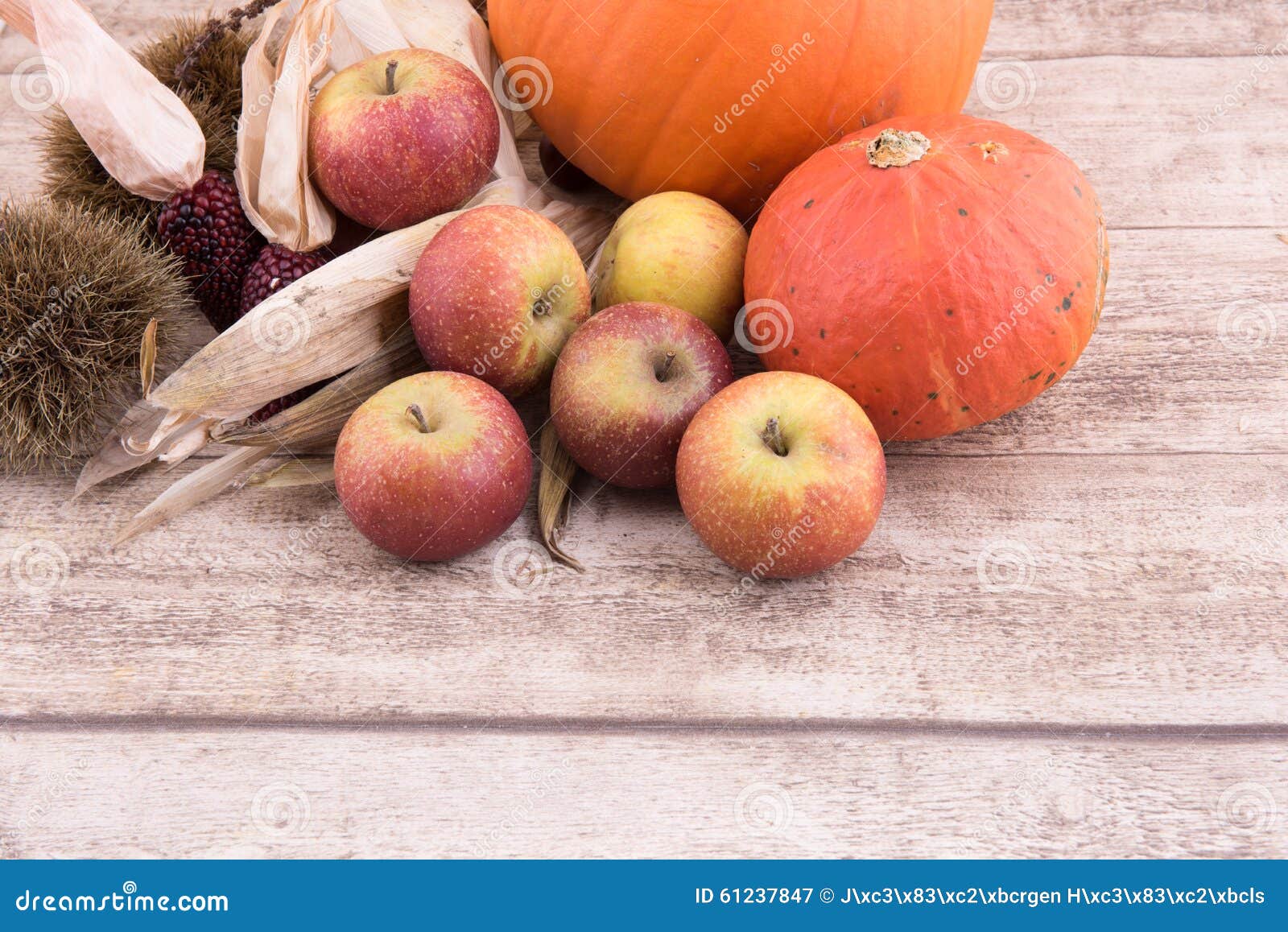 Fresh Apples, Chestnuts and Wheat on Wooden Background with Spac Stock ...