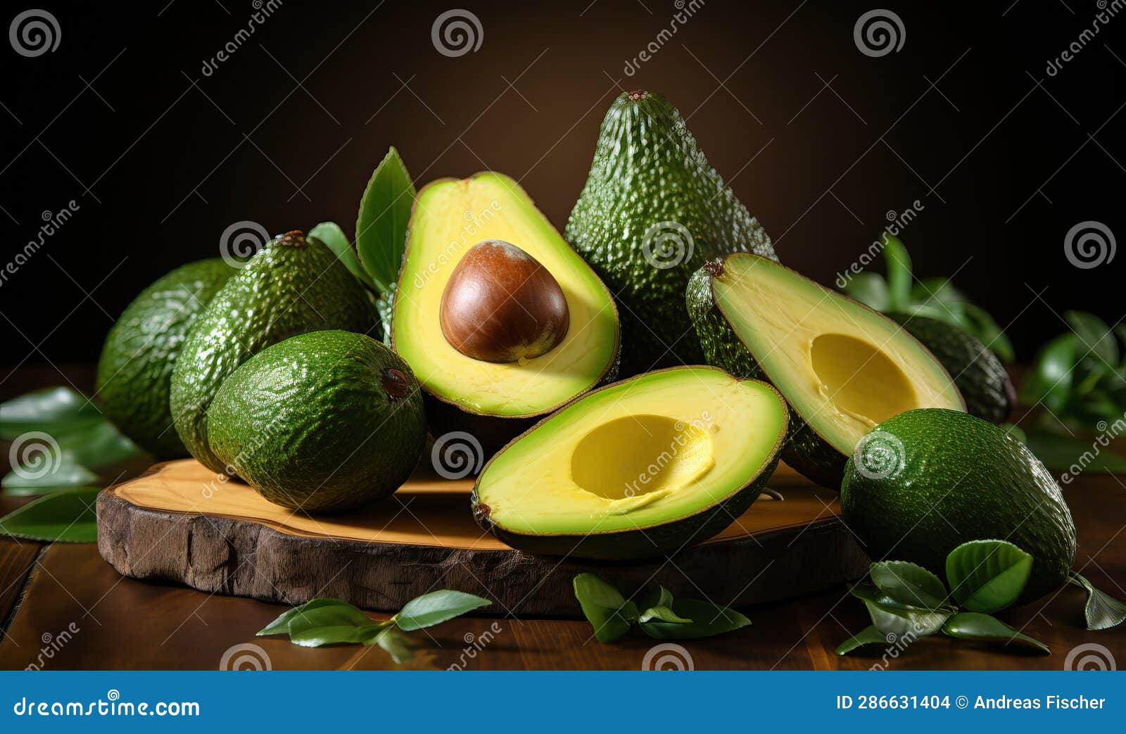 Fresh Avocado with Leaves on the Table, Closeup. Stock Photo Image