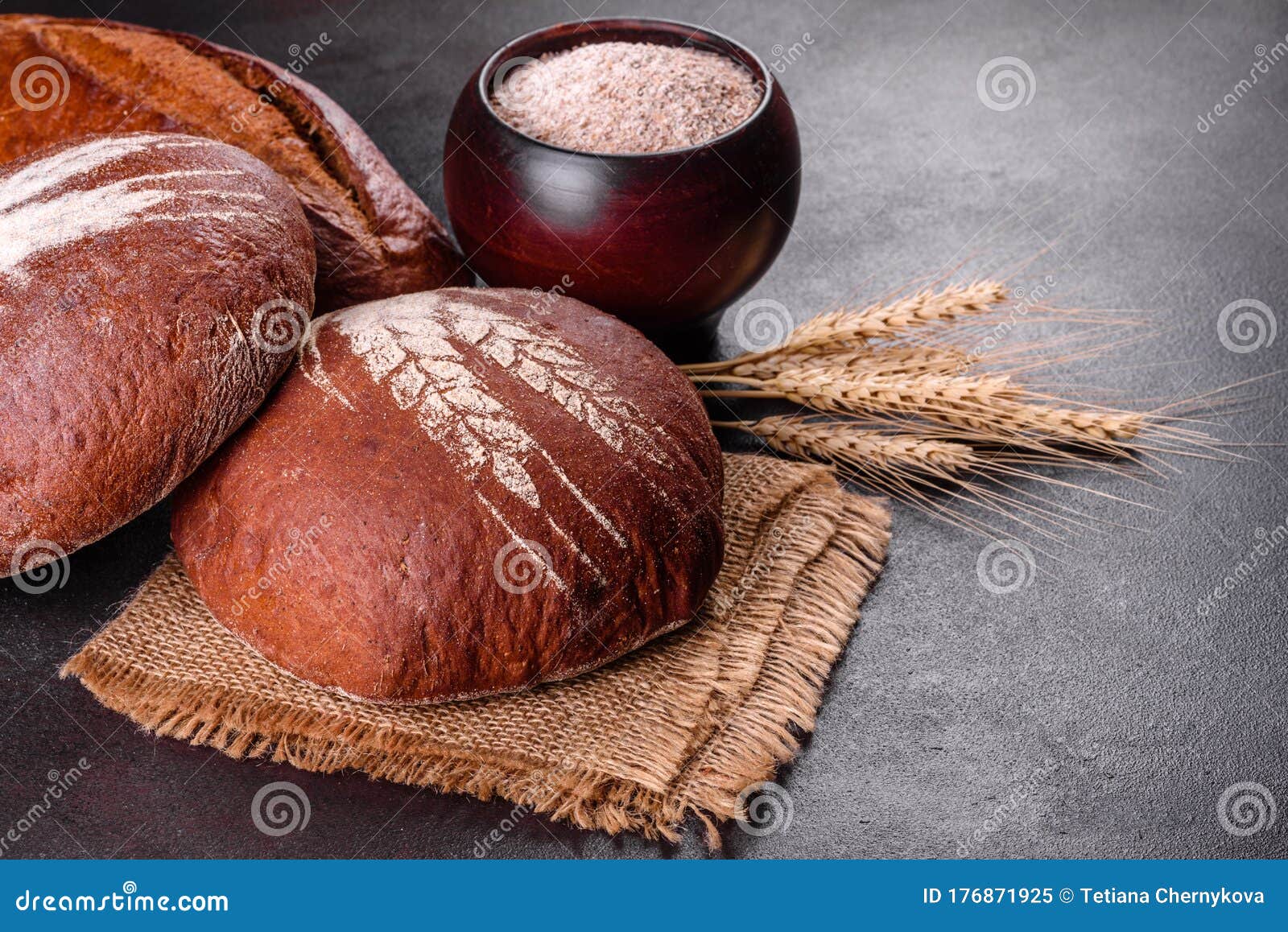 Fresh Baked Brown Bread on a Brown Concrete Background Stock Image