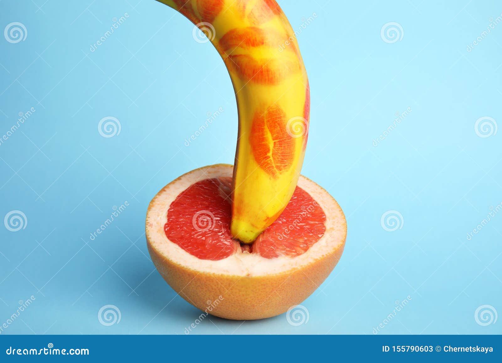 Fresh Banana With Red Lipstick Marks And On Blue Background Sex