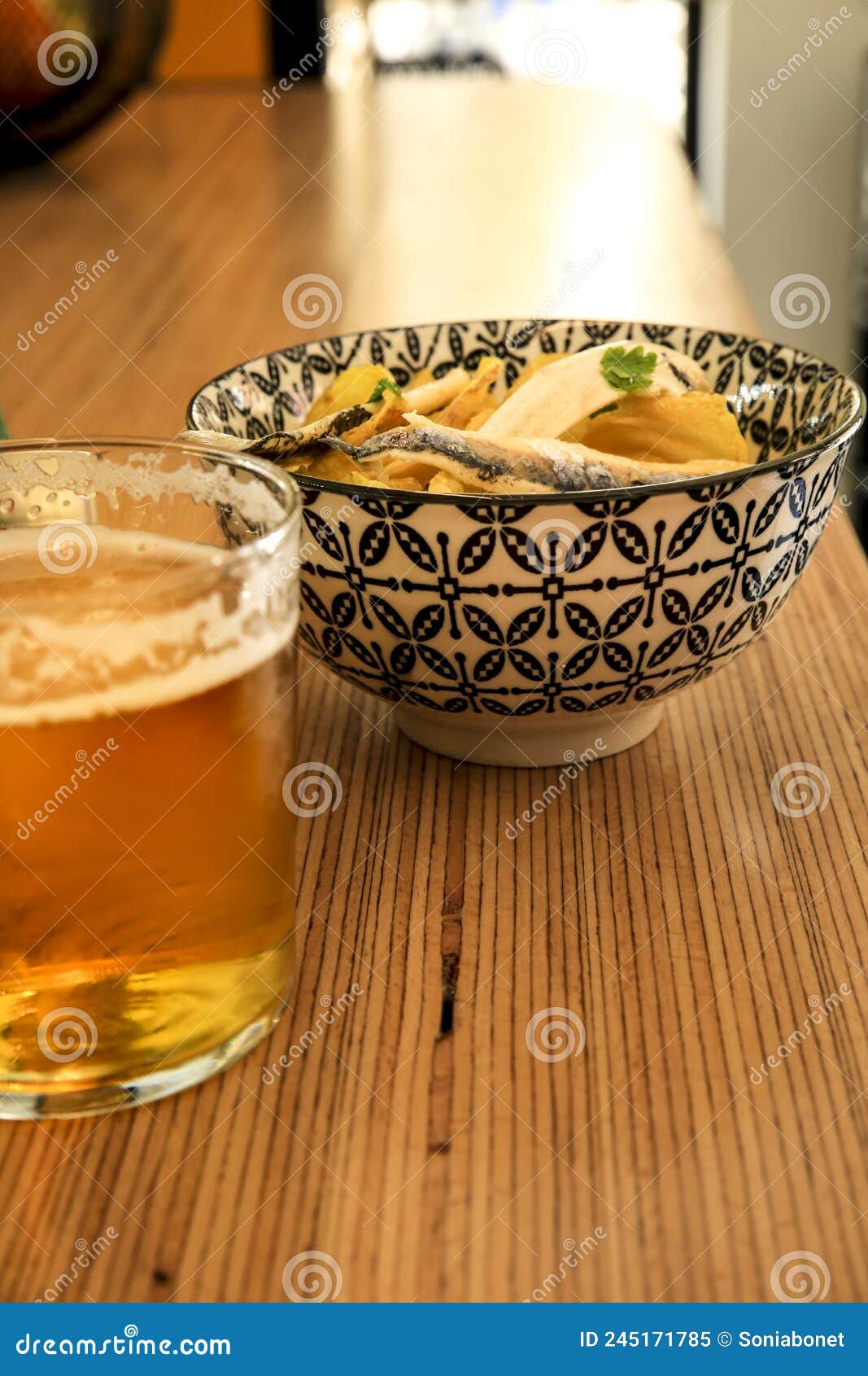 beer and spanish tapa on a bar counter