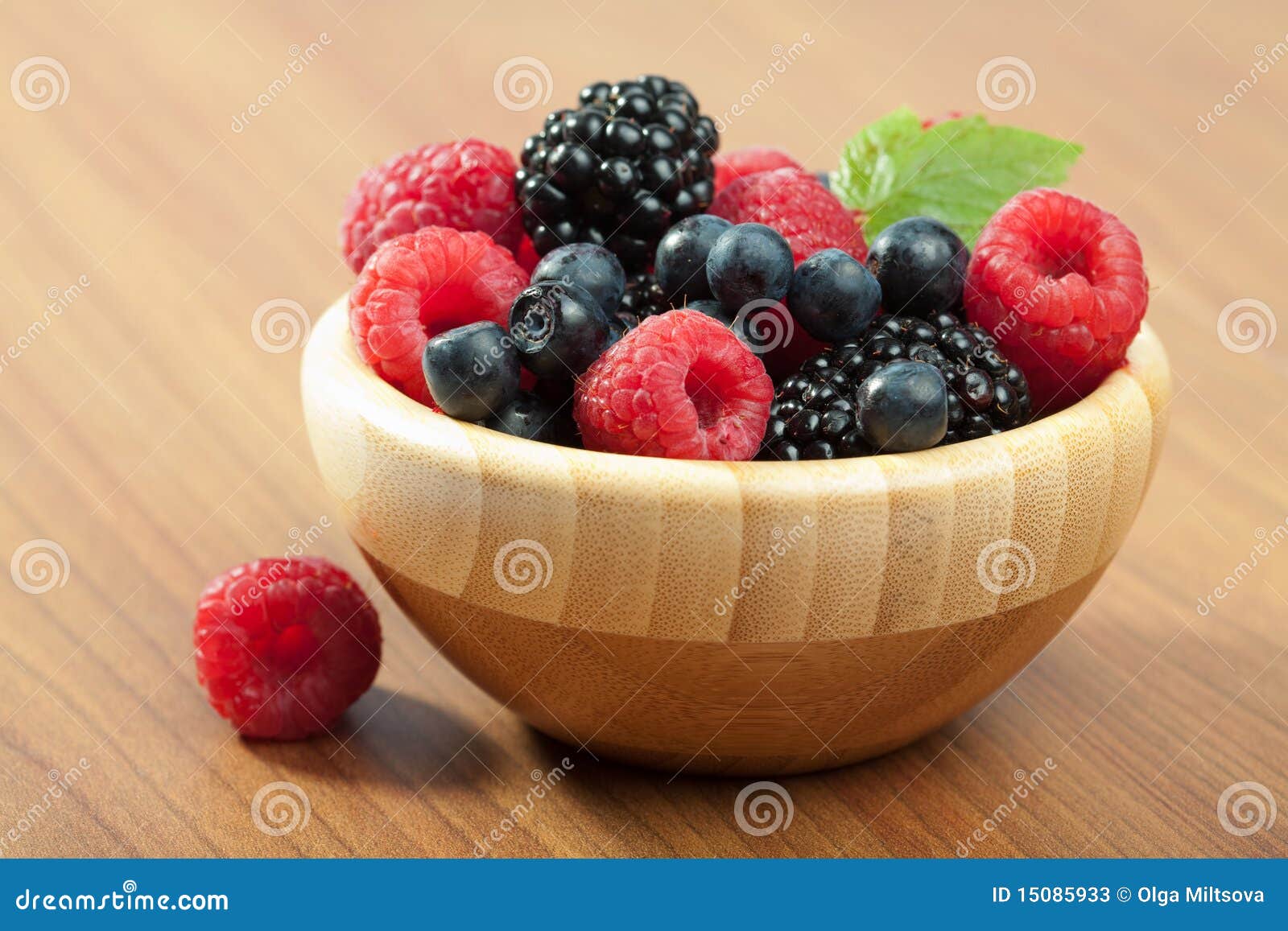 Fresh berries in wood bowl stock image. Image of gourmet 15085933