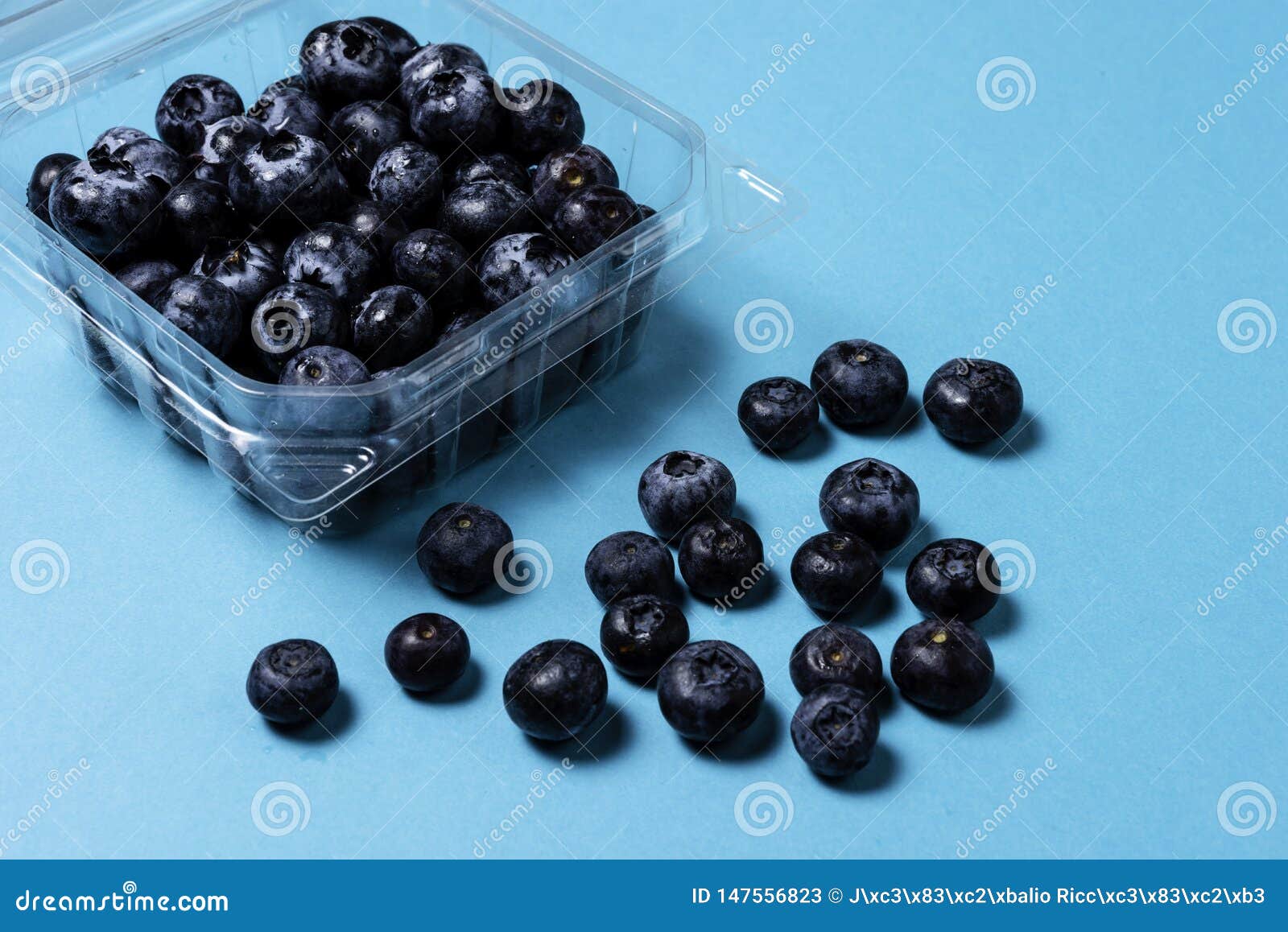 Download Fresh Blueberries Inside Plastic Container On Blue Background Stock Image Image Of Bluberry Group 147556823 Yellowimages Mockups