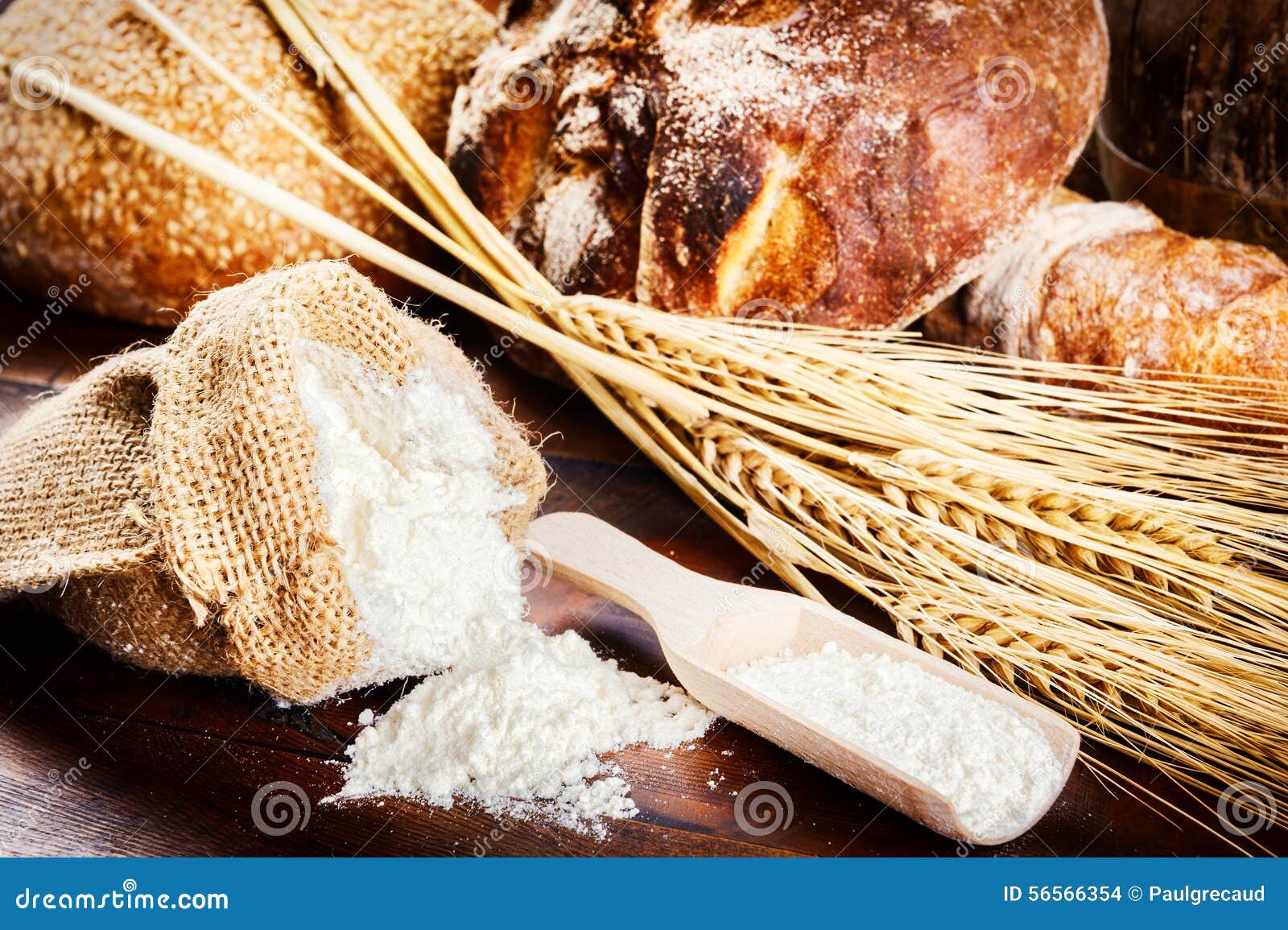 Fresh Bread and Baking Ingredients in Rustic Setting Stock Photo