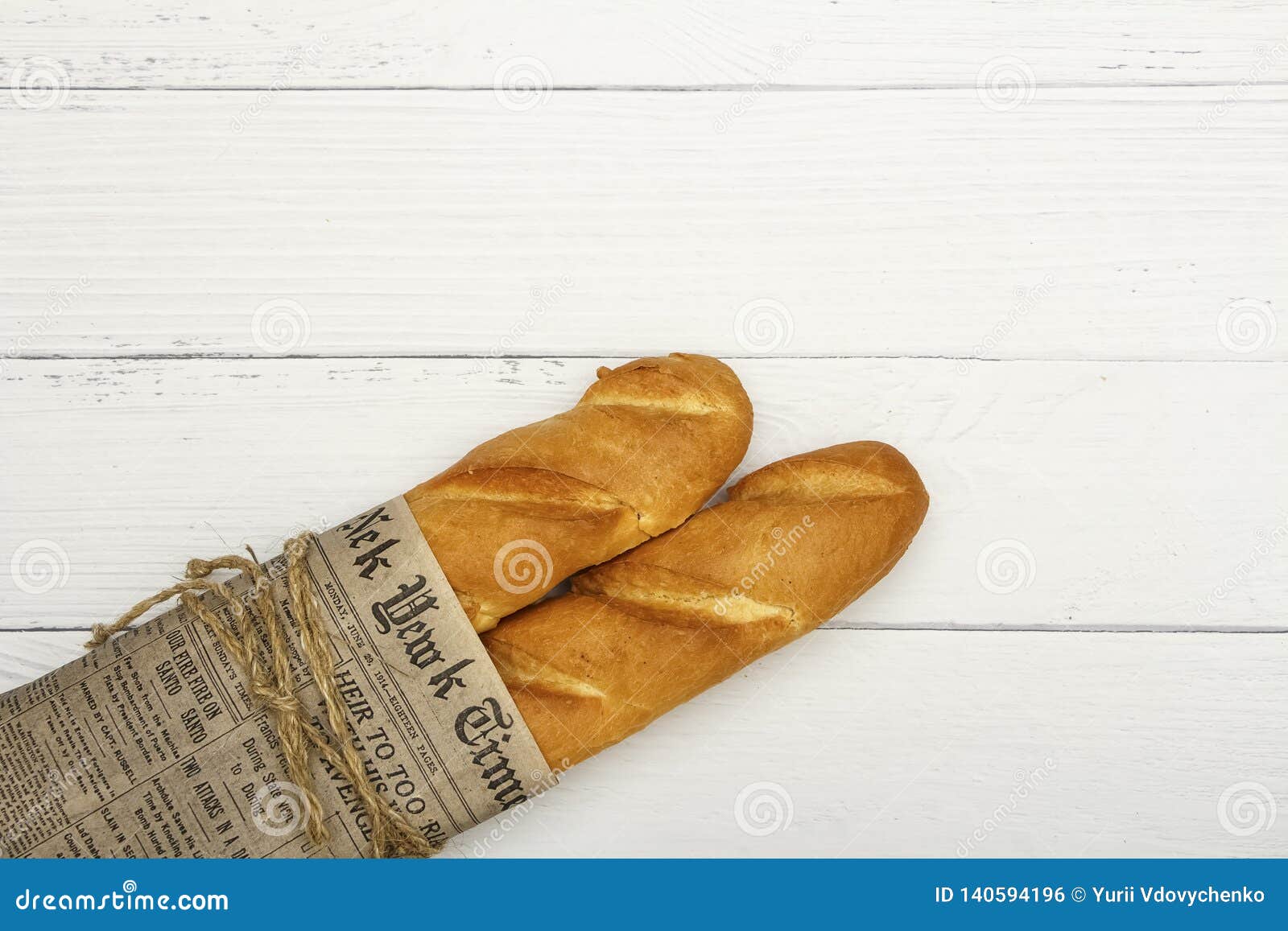 Baguette, European style bread on black wood table in morning time