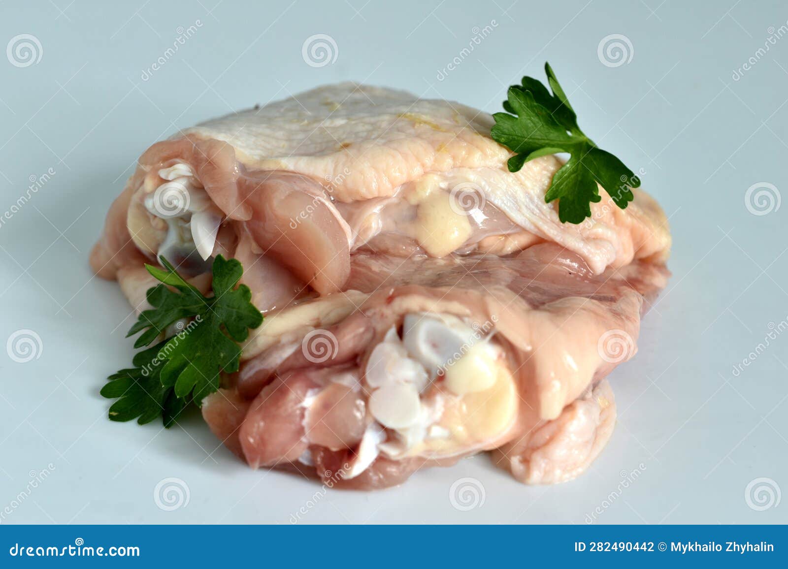 Chicken Meat, Thigh, on a White Background. Stock Photo Image of