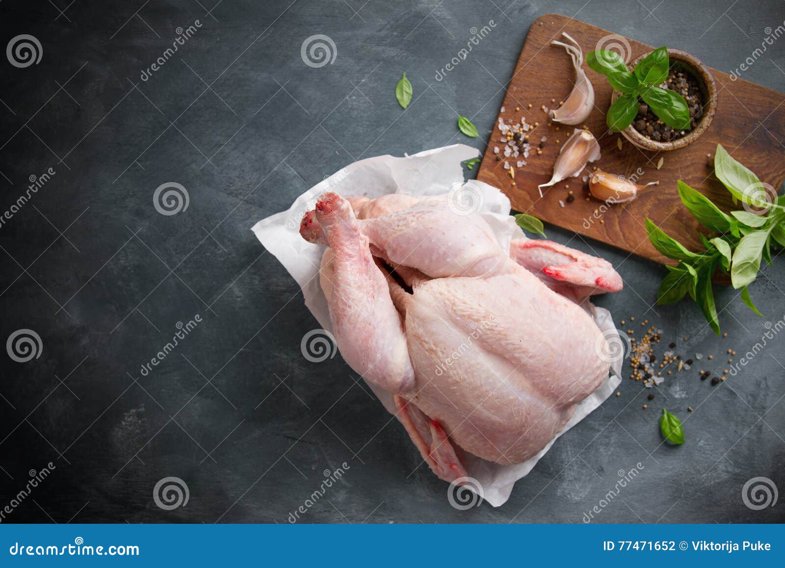 fresh chicken with spices on vintage background