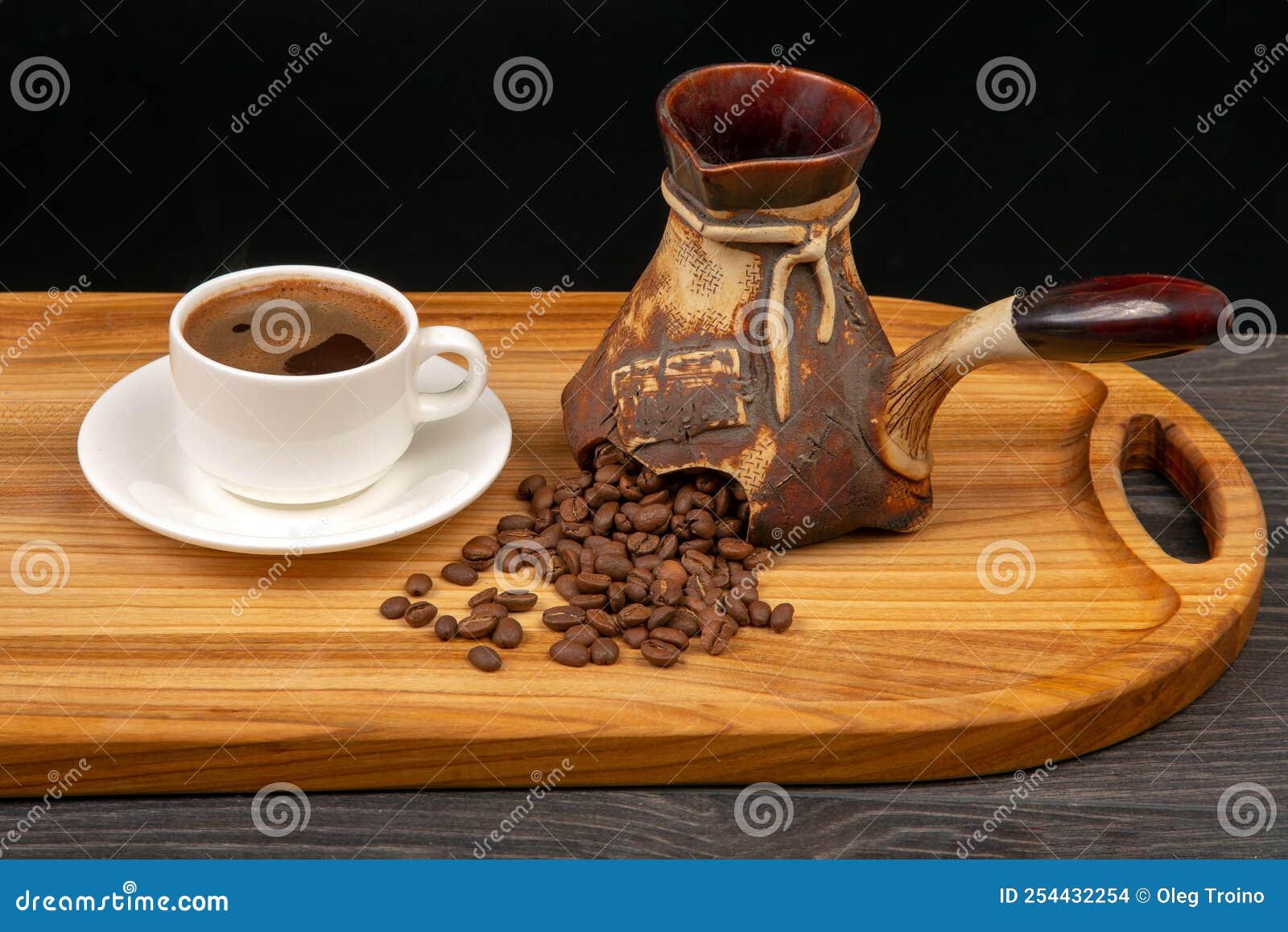 Fresh Coffee Beans Fall Out of Broken Ceramic Coffee Pot Stock Photo